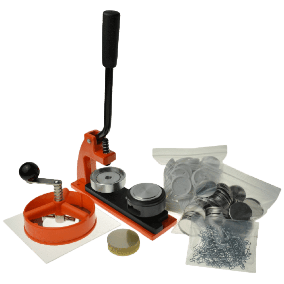 A button-making machine with a circular paper cutter and zip bags of button pins components (front metal backing, plastic metal backing, safety pins and transparent circular plastic sheets)